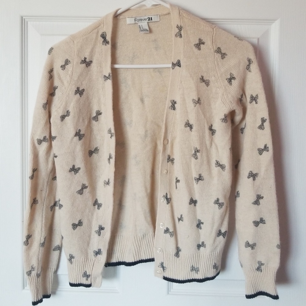 Cream cardigan with bowtie pattern
